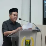 M. Yusuf saat menyampaikan laporan Komisi IV DPRD Kabupaten Sukabumi terkait Raperda tentang Penyelenggaraan Ketenagakerjaan di dalam Rapat Paripurna, Senin (10/7/2023). (Sumber : Dok. DPRD)